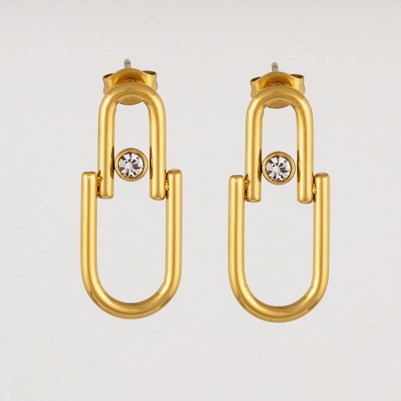 BRINCO EM AÇO DOURADO COM CRISTAL